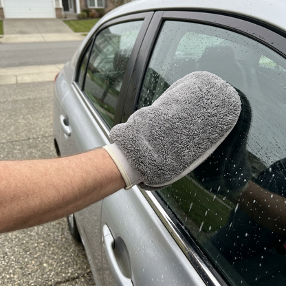 Realistic driveway photo of the grey wash mitt in use